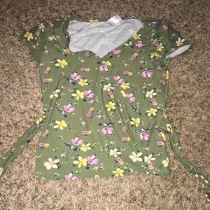 Stretchy, short sleeve, low v-cut, green shirt with flowers on it